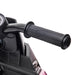 Close-up of black handlebar on pink kids electric motorbike toy with safety features