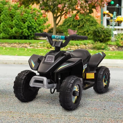 Black kids 6V electric quad bike on pavement, outdoor setting, toy vehicle with rugged wheels