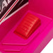 Close-up of red foot pedal on pink kids electric quad bike with sporty decal