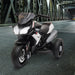 Black 6V kids electric ride-on motorbike with working lights on metal bridge at night