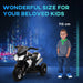6V kids electric ride-on motorbike with lights beside boy height chart, urban night background