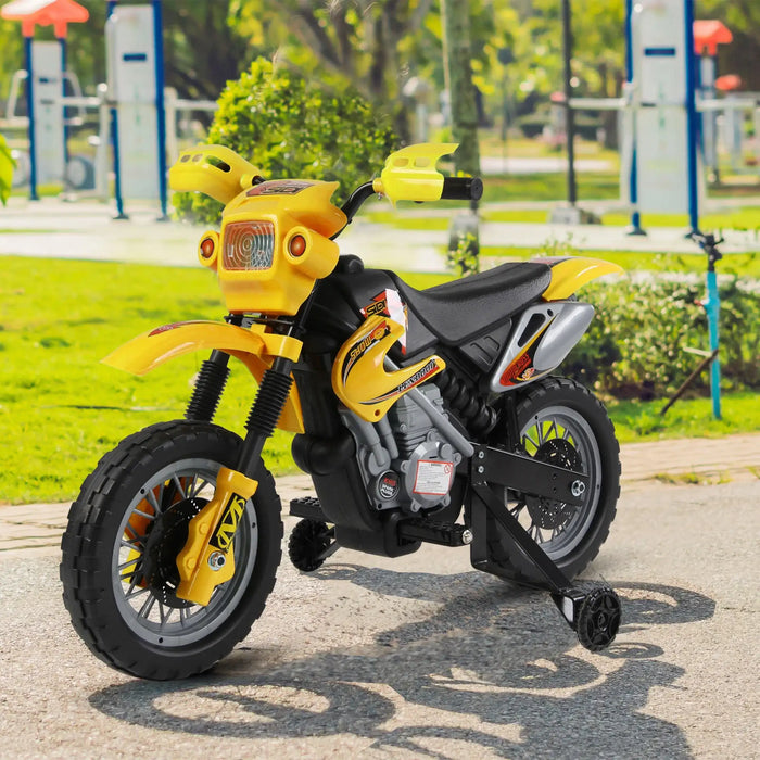 Yellow kids electric ride-on motorbike with training wheels in a park setting