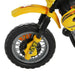 Close-up of yellow kids' electric ride-on motorbike front wheel with training wheels