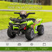 Green kids' electric ride-on ATV quad bike with music and racing stickers, outdoor setting