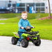 Child riding green 6V electric ride-on quad ATV with music and racing stickers outdoors