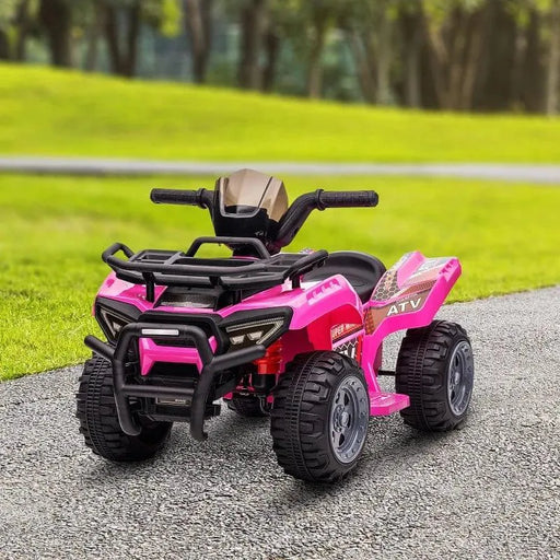 Pink kids electric ride-on ATV quad bike with racing stickers on a park path