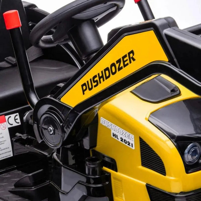 Close-up of yellow kids ride-on bulldozer toy with black steering wheel and PUSHDOZER label