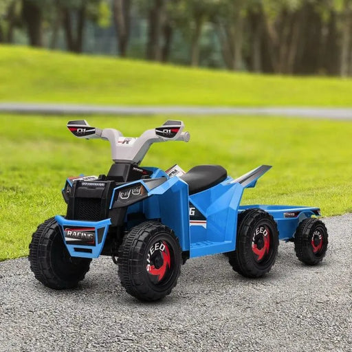 Blue kids ride-on quad bike with trailer on a path in a grassy park setting.