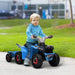 Toddler riding blue 6V kids ride-on quad bike with trailer outdoors on grass