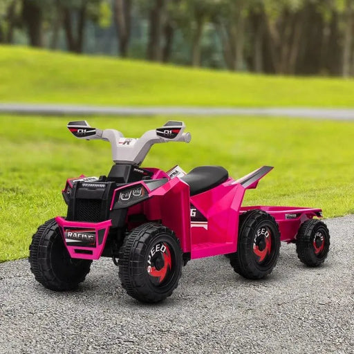 Pink kids ride-on quad bike with trailer on outdoor path, toy vehicle for children