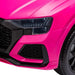 Close-up of pink kids electric ride-on Audi RS Q8 car front headlight and grill