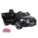 Black BMW 6 GT kids ride-on car with open door and red remote control