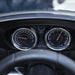 Close-up of BMW 6GT kids ride-on car dashboard with speedometer and gauges