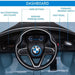BMW i8 kids electric ride-on car dashboard with labeled steering wheel, MP3 player, and controls