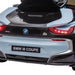 Rear view of blue BMW i8 Coupe kids electric ride-on car with LED tail lights
