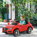 Boy riding red Mercedes AMG kids electric ride-on car outdoors
