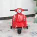 Red Vespa kids electric ride-on motorbike with stabilisers on playroom floor