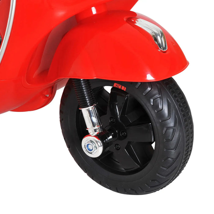 Front wheel of red kids electric Vespa ride-on motorcycle with training wheel
