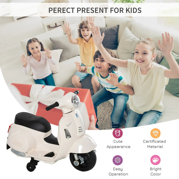 Kids excited with white Vespa electric ride-on motorcycle gift with training wheels indoors