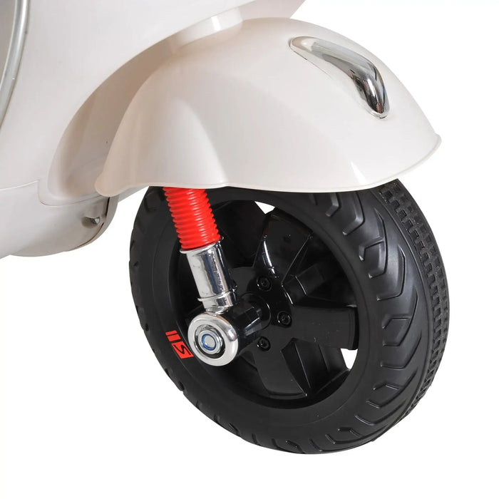 Close-up of a black scooter wheel with red suspension and white fender against a white background