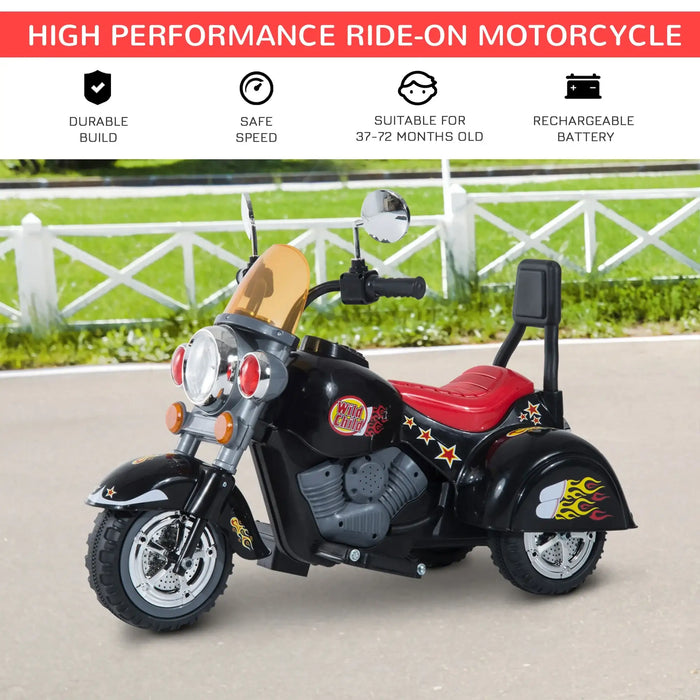 Black 3-wheel kids' electric ride-on motorbike with red seat, outdoors on pavement