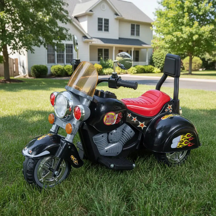 Black 6V retro style kids electric ride-on motorbike trike on grass in front of house