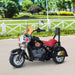 Black retro-style kids electric ride-on motorbike with three wheels and flame decals outdoors