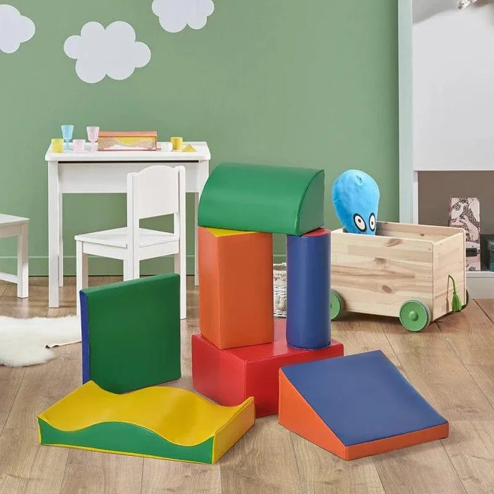Multi-coloured 7-piece foam shape set for kids in playroom with wooden floor