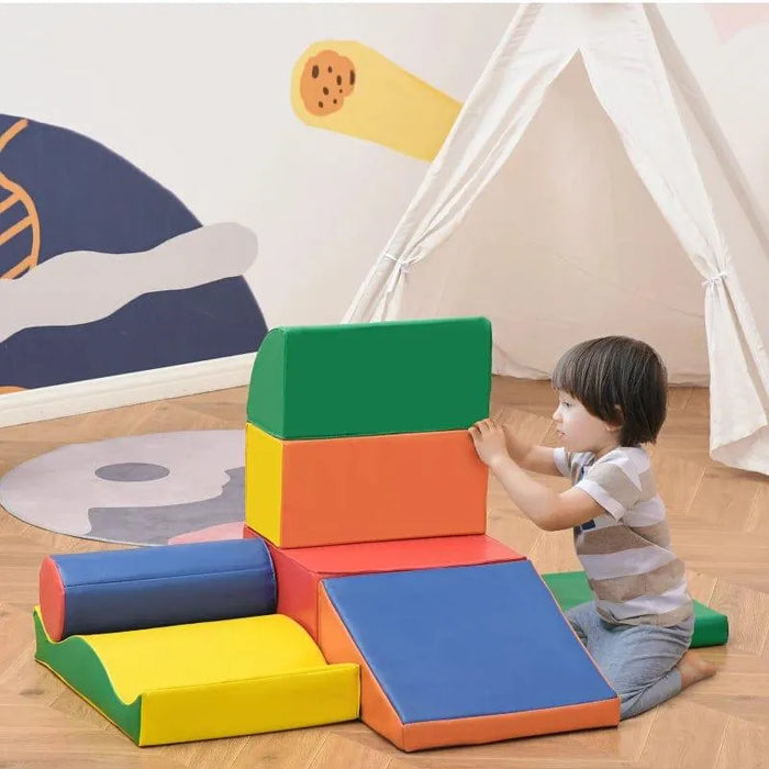 Child playing with 7-piece multicolored foam shape blocks in a playroom with teepee tent