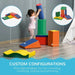 Child playing with multi-coloured foam blocks set for interactive educational play indoors.