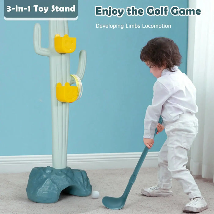 Child playing with a golf game toy set against a blue wall.