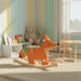 Wooden fox rocking toy with a colorful tail in a plush playroom