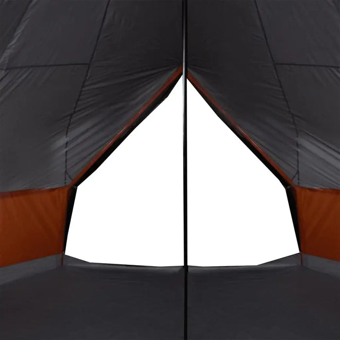 Inside view of grey and orange 8 person tipi family tent with central pole and modern design