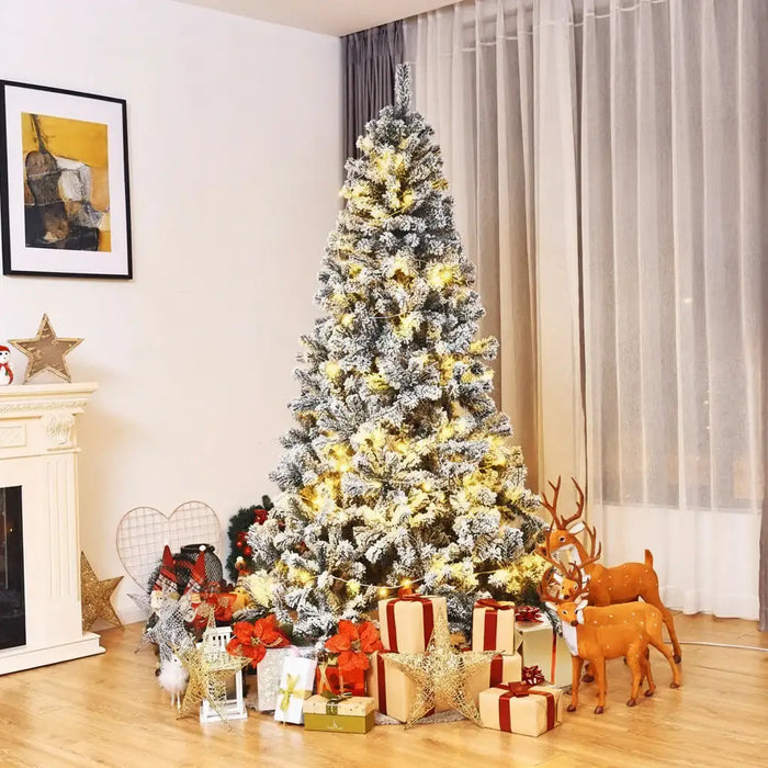 Decorated Christmas tree with lights and presents in a living room setting.