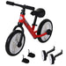 Red and black toddler balance bike with white wheels, black pedals, and training wheels