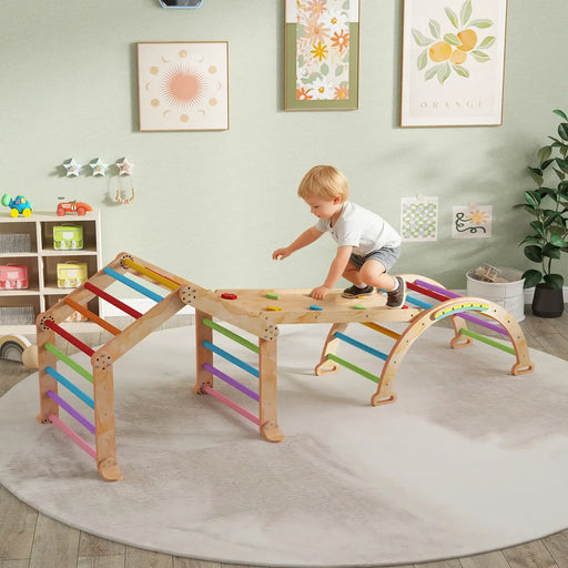 Child playing on a colorful wooden climbing structure in a room with shelves and wall art.