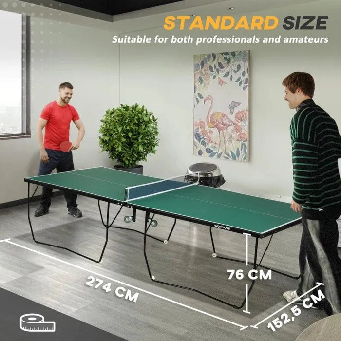 Two people playing table tennis on a green 9ft professional ping pong table indoors.