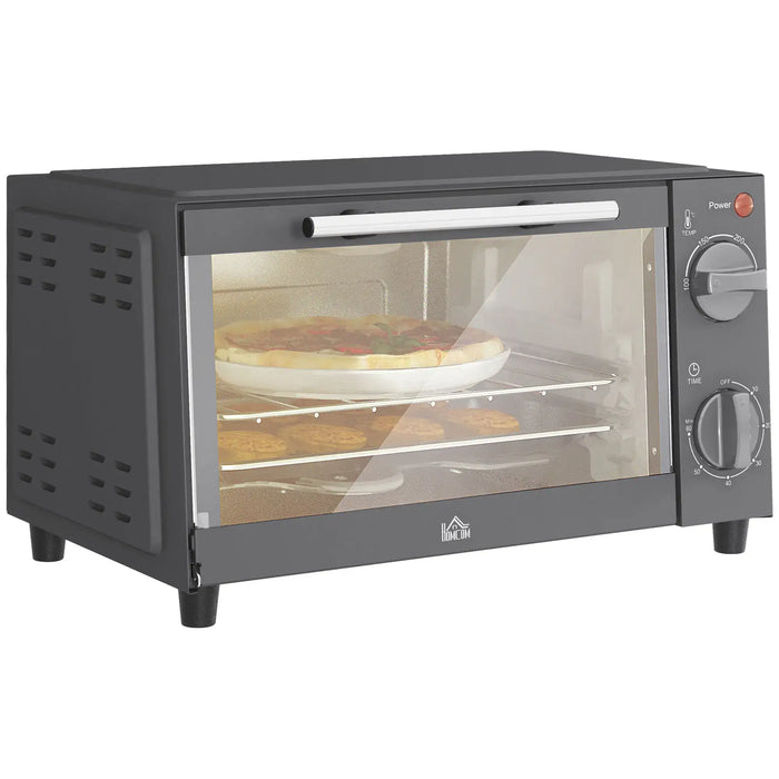 Black toaster oven with pizza inside on a white background