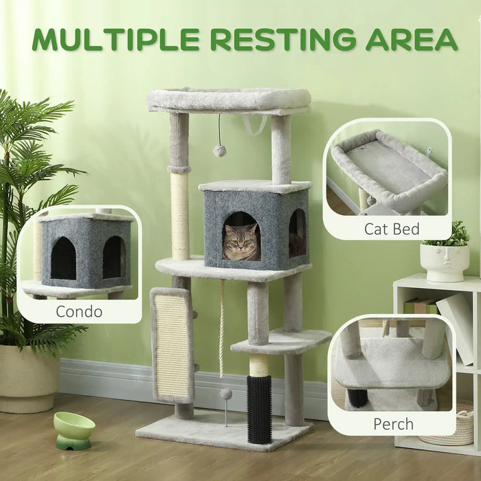 Gray multi-level cat tree with condo, perch, and bed for cats in a green room
