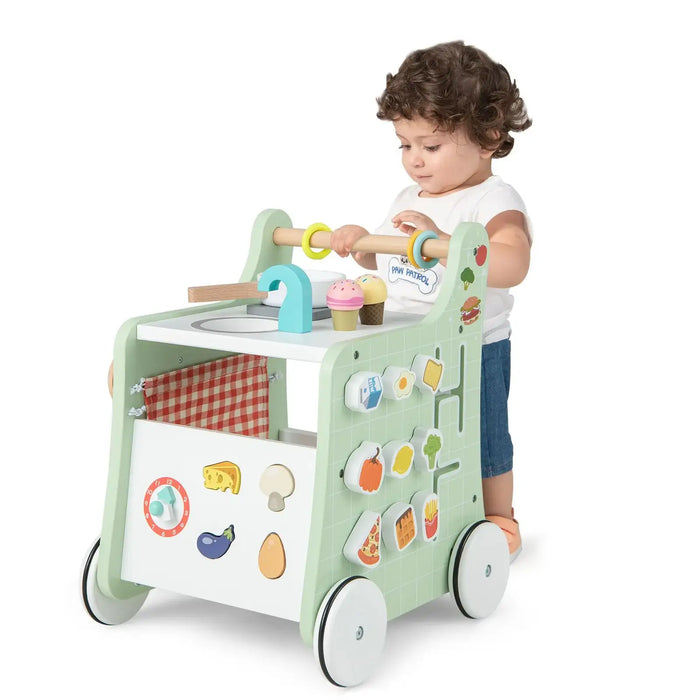 Child playing with a colorful toy cart on a white background