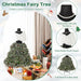 Christmas Fairy Tree styled with a detachable plush shawl and pearl necklace on a black mannequin in a cozy living room