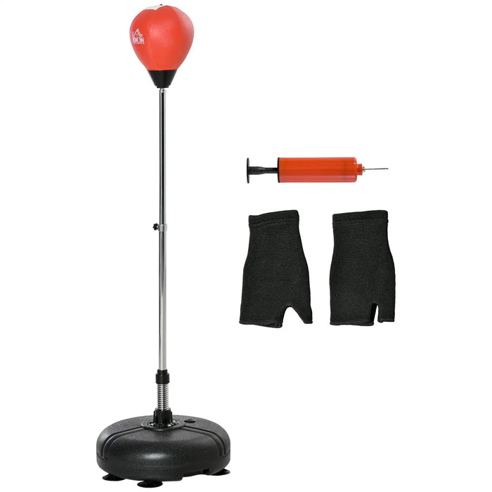 Adjustable freestanding red punching ball with pump and black hand wraps for boxing training