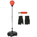 Adjustable freestanding red punching ball with pump and black hand wraps for boxing training