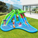 Giant green and blue inflatable bounce house water slide shaped like a crocodile with kids playing outdoors