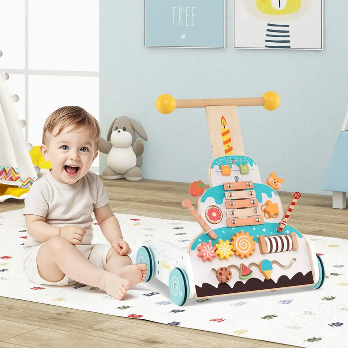 Child playing with a toy cake walker in a room with colorful decor