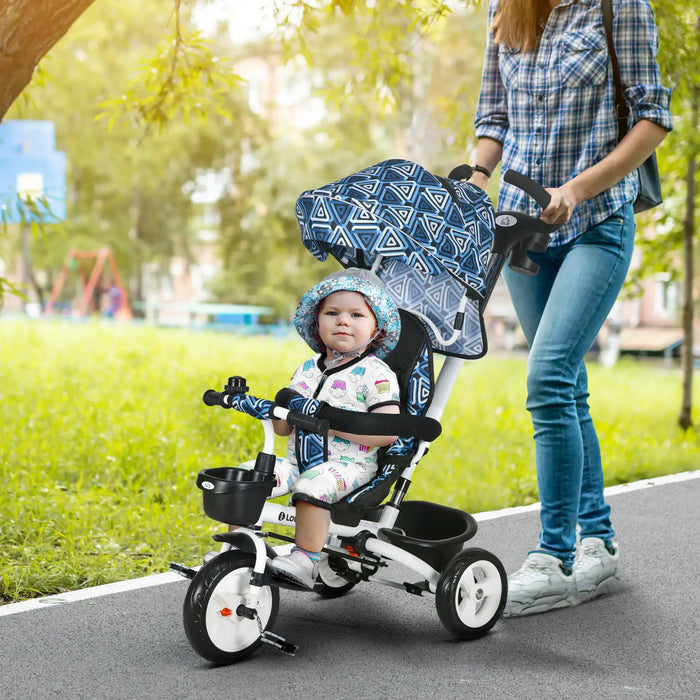 Child in a stroller being pushed by an adult on a path with greenery in the background