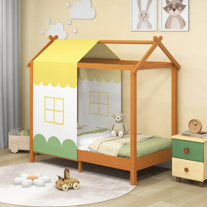 Children's bed with canopy in a room decorated with toys and furniture.