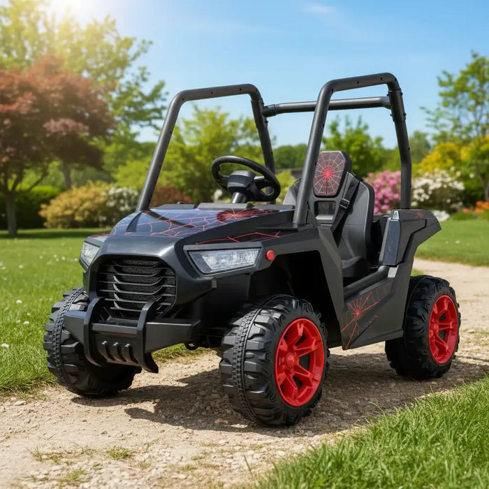 Black kids ride-on car with red spider web design and red wheels on garden path
