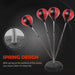 Red and black punching ball with spring base for rebound training on a black background