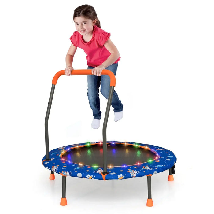 Child playing on a trampoline with colorful lights on a white background